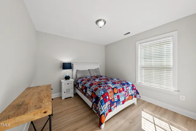 a view of a patio with a table chairs and a backyard