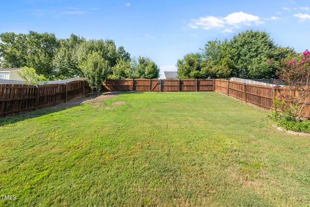 a view of a hallway with white walls