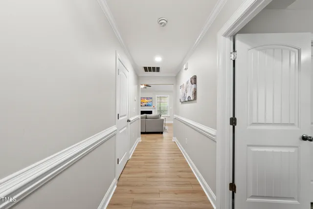 a living room with fireplace furniture and a flat screen tv