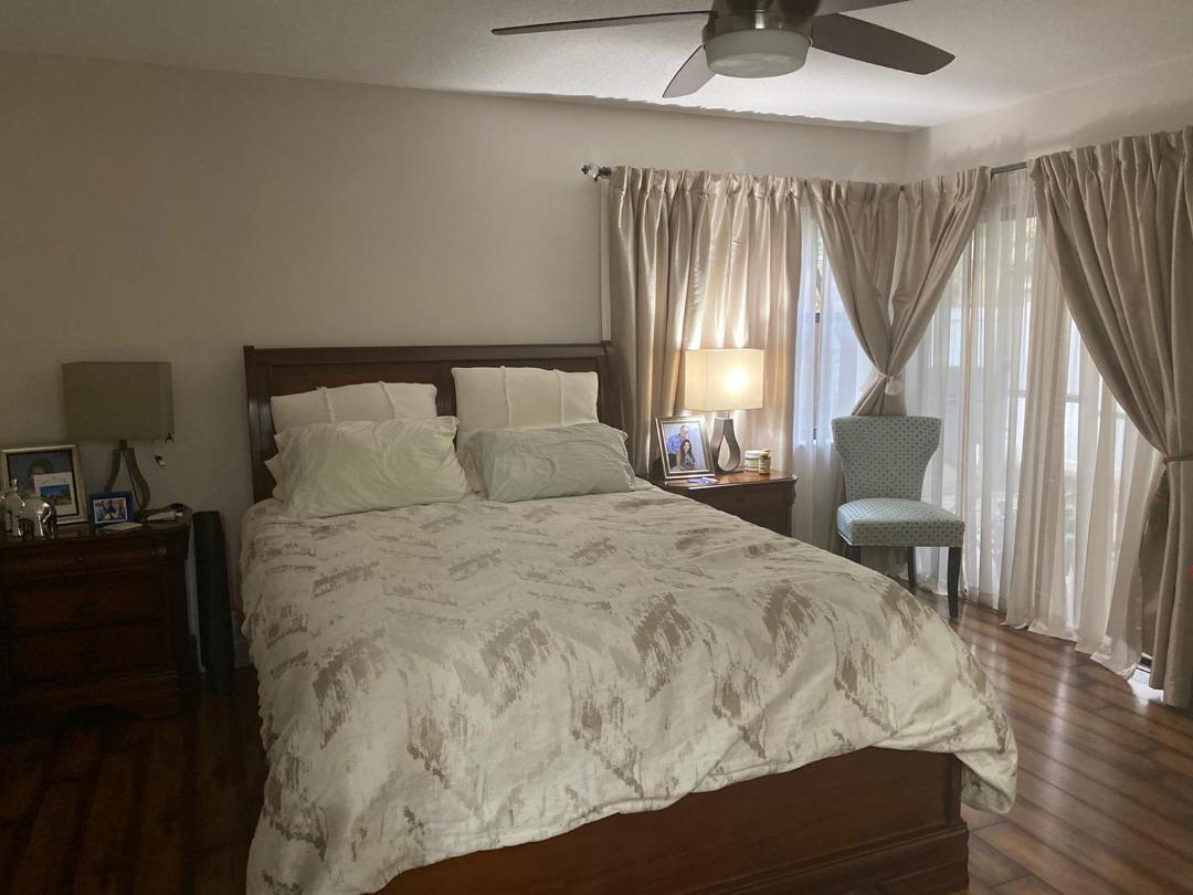 6657 Boca Hermosa Lane Boca Raton, FL 33433 - Photo 11 of 33 a bedroom with a bed window and a table