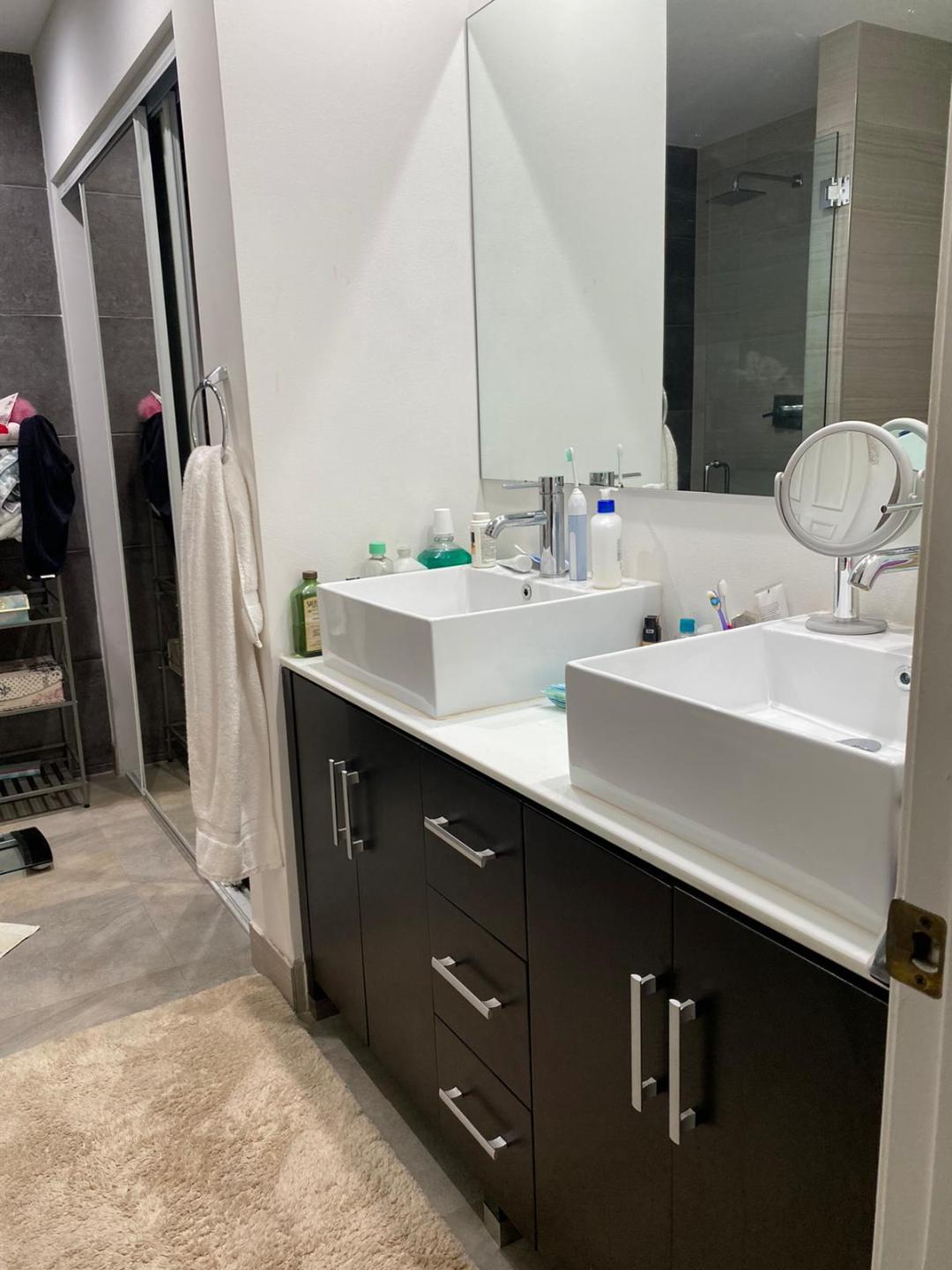 6657 Boca Hermosa Lane Boca Raton, FL 33433 - Photo 13 of 33 a bathroom with a double vanity sink a and mirror