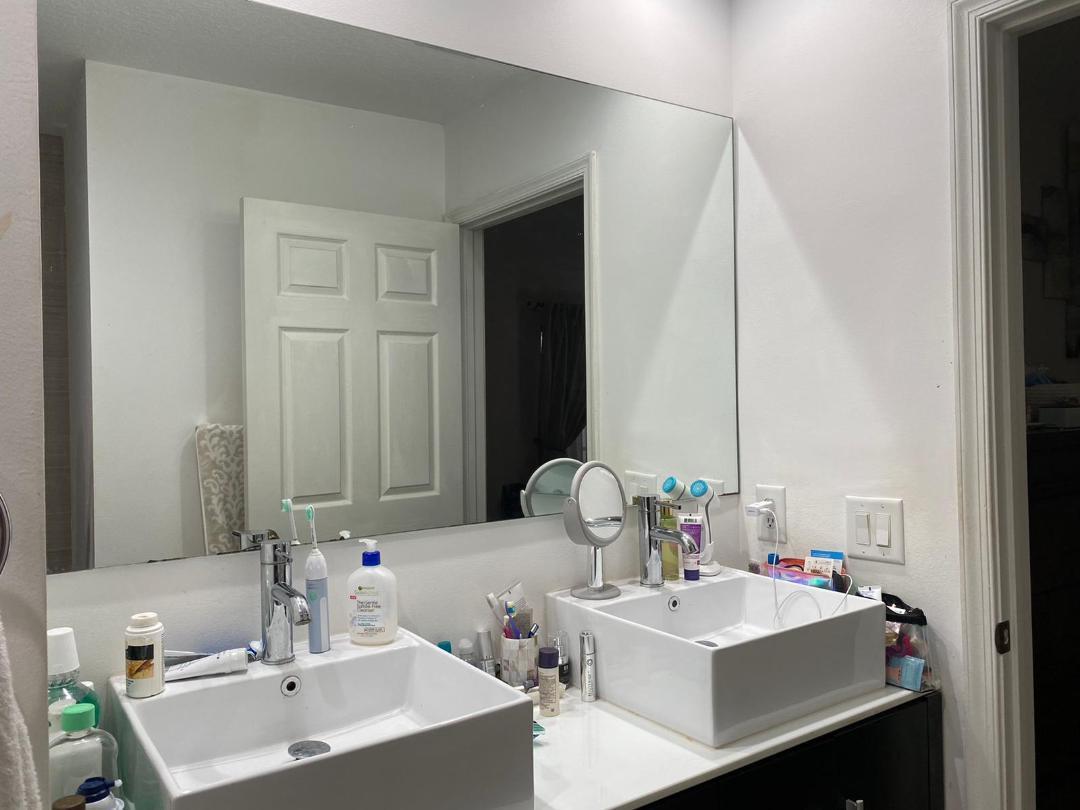 6657 Boca Hermosa Lane Boca Raton, FL 33433 - Photo 14 of 33 a bathroom with a sink and a mirror
