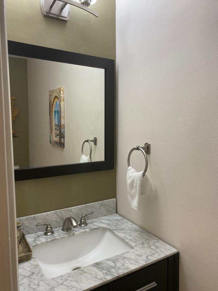 6657 Boca Hermosa Lane Boca Raton, FL 33433 - Photo 18 of 33 a bathroom with a sink and a mirror