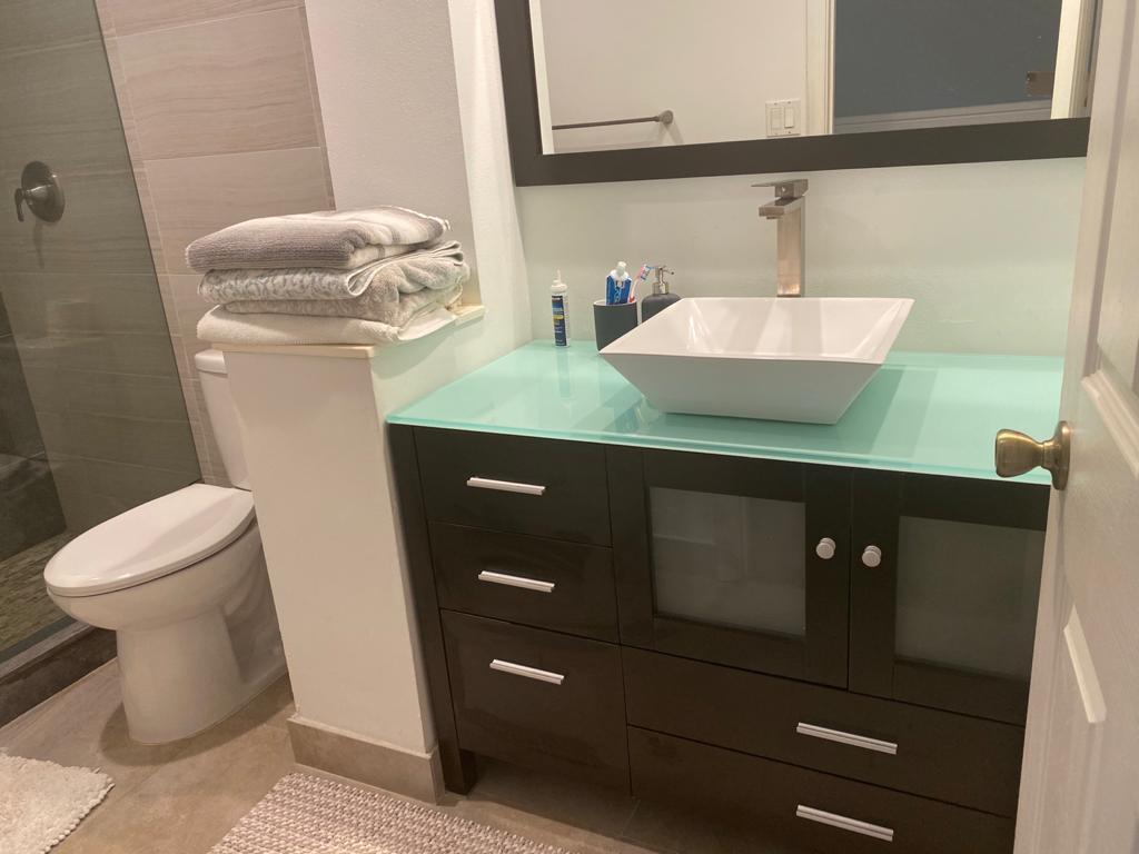 6657 Boca Hermosa Lane Boca Raton, FL 33433 - Photo 24 of 33 a bathroom with a sink a toilet and mirror