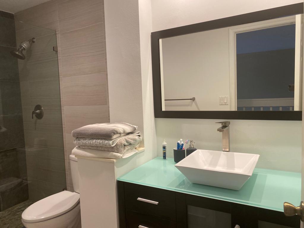 6657 Boca Hermosa Lane Boca Raton, FL 33433 - Photo 25 of 33 a bathroom with a sink toilet and mirror