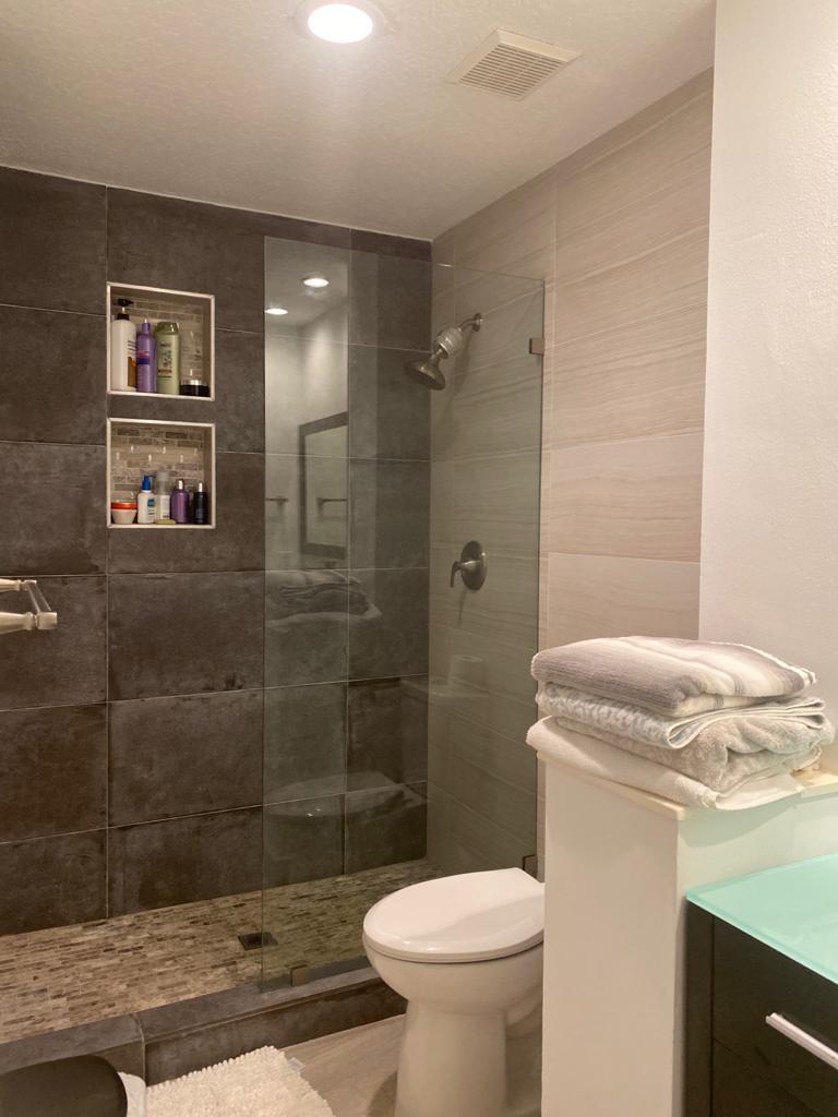 6657 Boca Hermosa Lane Boca Raton, FL 33433 - Photo 26 of 33 a bathroom with a sink a toilet and shower