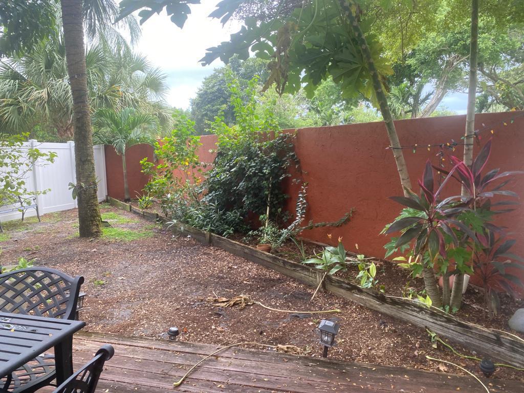 6657 Boca Hermosa Lane Boca Raton, FL 33433 - Photo 30 of 33 a backyard of a house with lots of green space