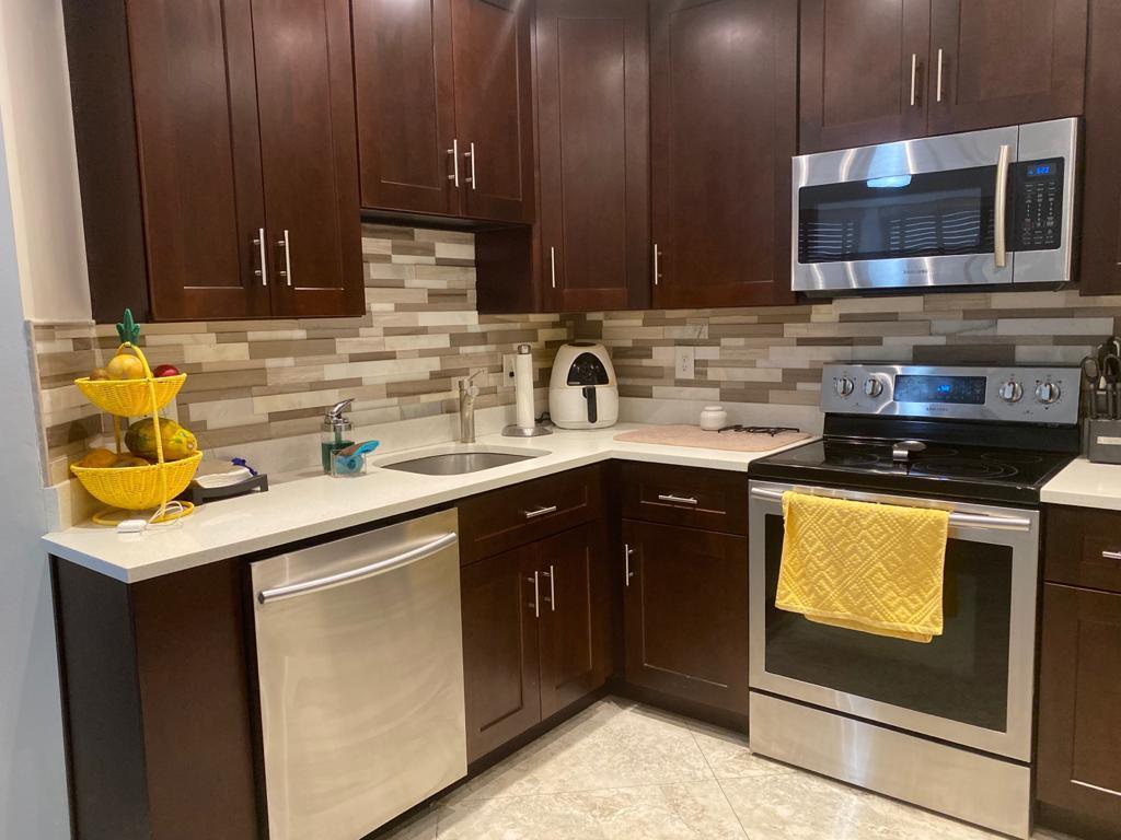 6657 Boca Hermosa Lane Boca Raton, FL 33433 - Photo 6 of 33 a kitchen with a sink and cabinets