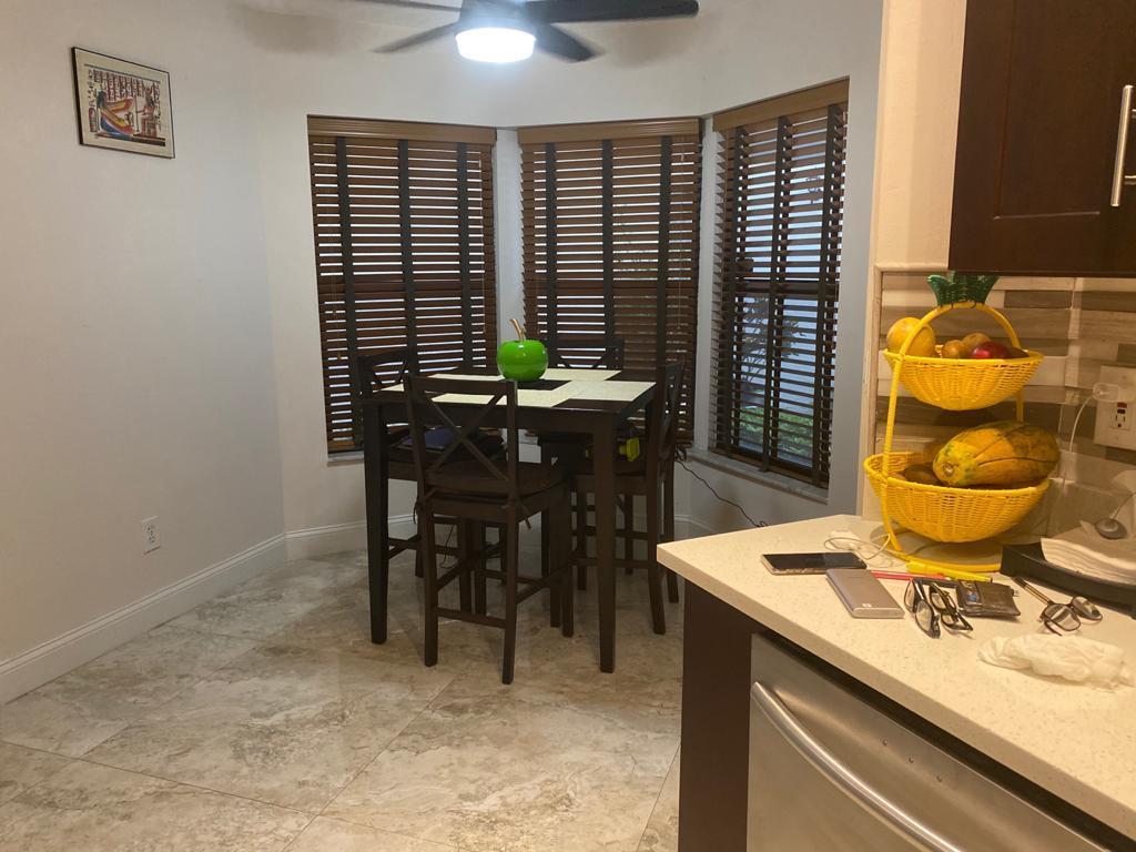 6657 Boca Hermosa Lane Boca Raton, FL 33433 - Photo 7 of 33 a dining room with a window
