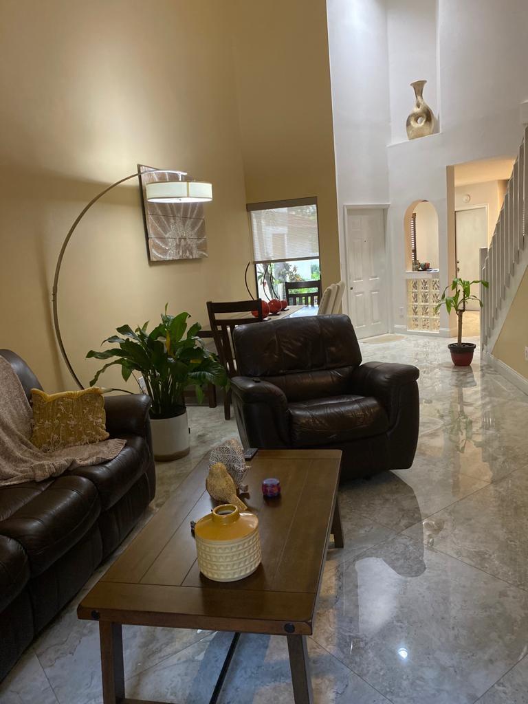 6657 Boca Hermosa Lane Boca Raton, FL 33433 - Photo 9 of 33 a living room with furniture and wooden floor