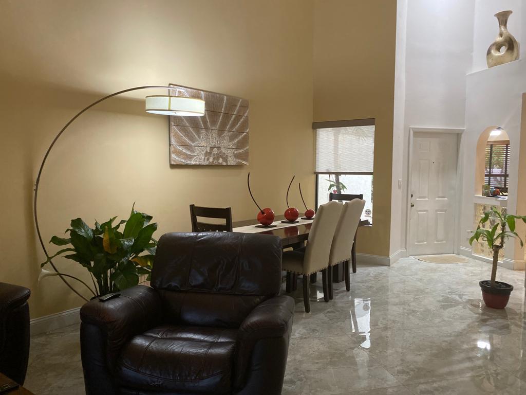 6657 Boca Hermosa Lane Boca Raton, FL 33433 - Photo 10 of 33 a living room with furniture flowerpot and wooden floor