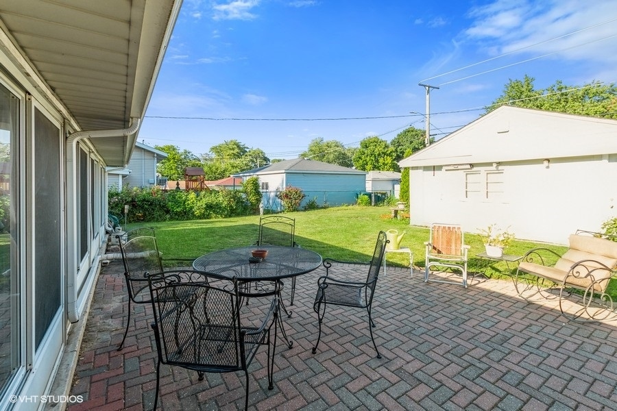10643 Oxford Avenue Chicago Ridge, IL 60415 - Photo 13 of 15 a view of a chairs and table in patio with a yard