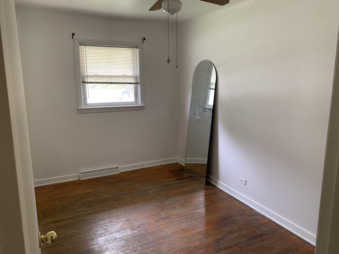 10643 Oxford Avenue Chicago Ridge, IL 60415 - Photo 9 of 15 an empty room with wooden floor and windows