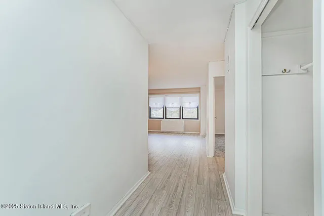 a view of a livingroom with furniture and wooden floor