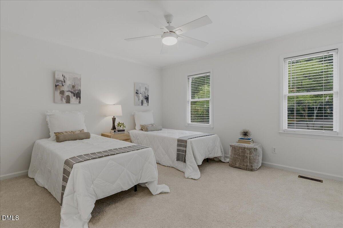 2834 Wayland Drive Raleigh, NC 27608 - Photo 17 of 26 a bedroom with two beds and a window