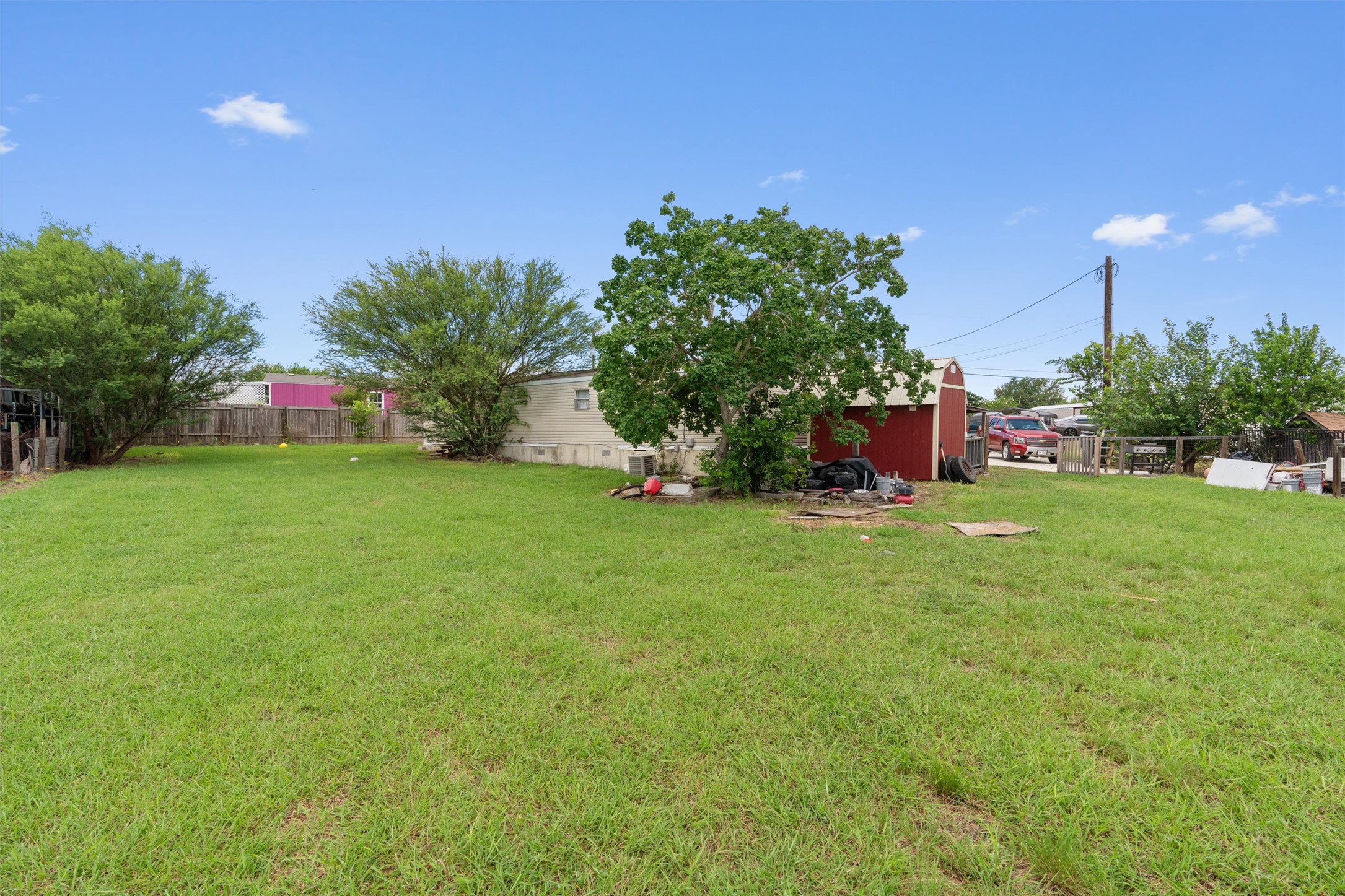 218 Boxcar Path Kyle, TX 78640 - Photo 15 of 21 A spacious, verdant yard provides ample outdoor living space.