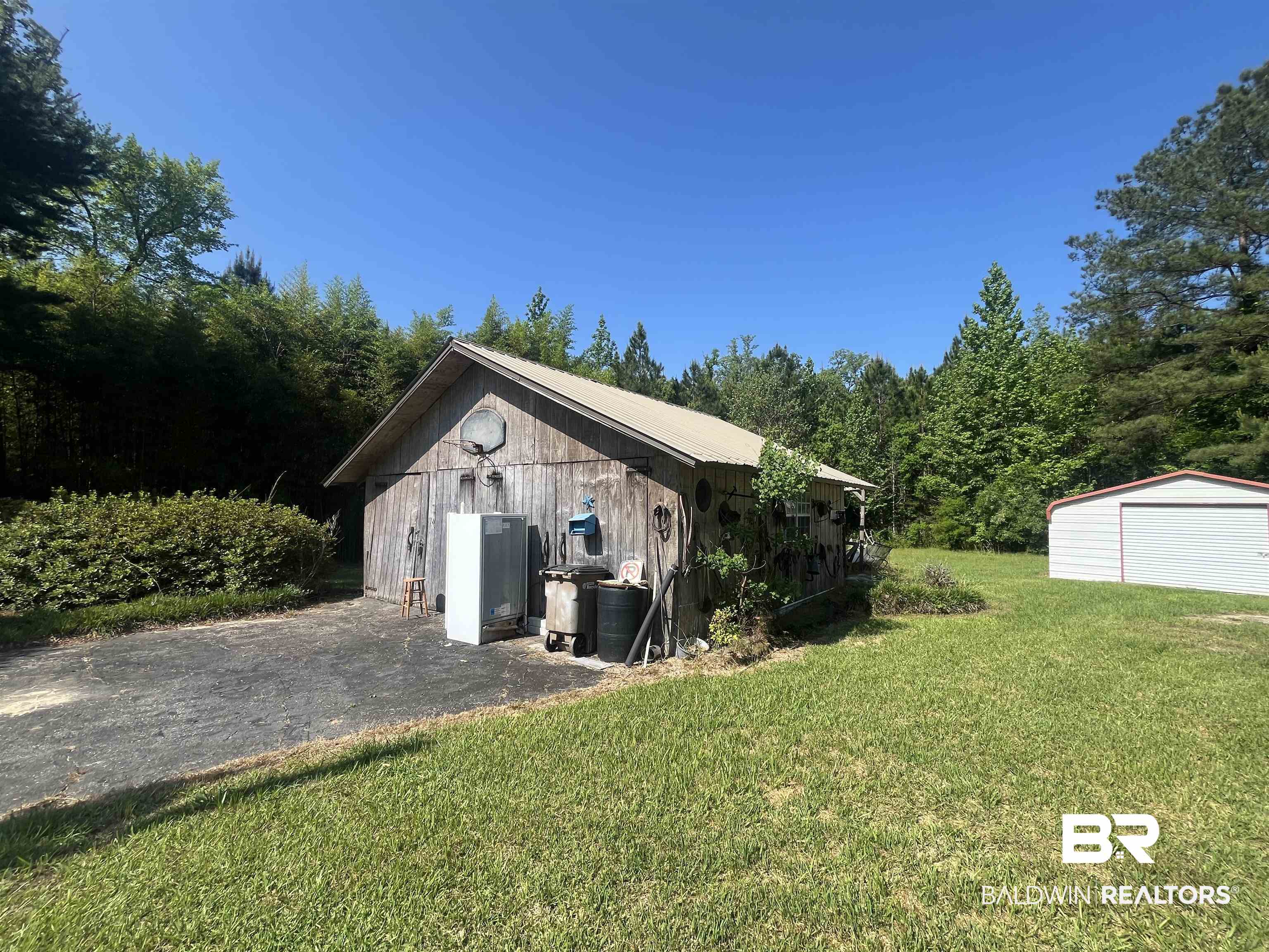315 Dawkins Road Brewton, AL 36426 - Photo 5 of 19 Detached garage featuring a storage unit