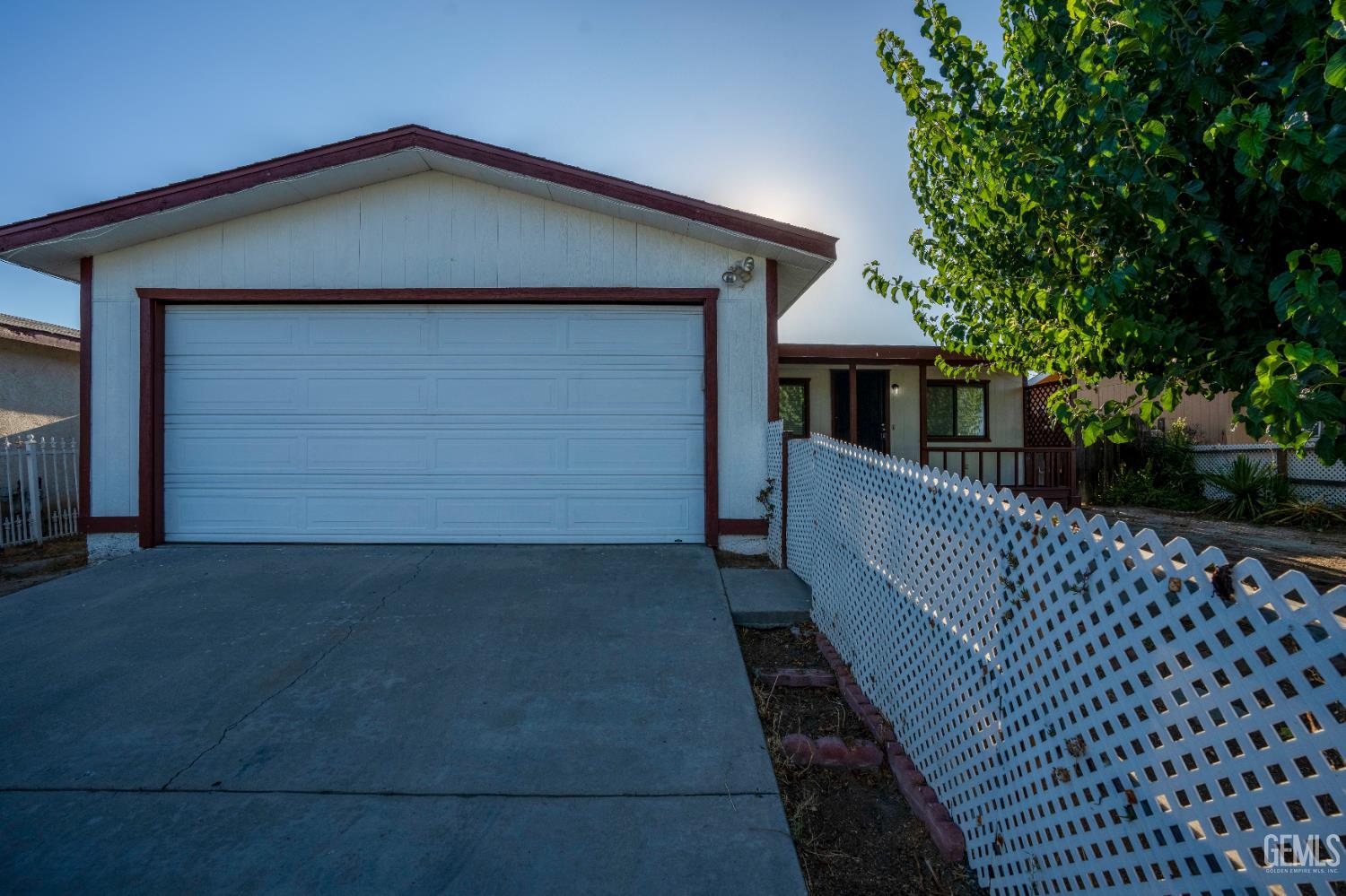 a front view of a house with garage