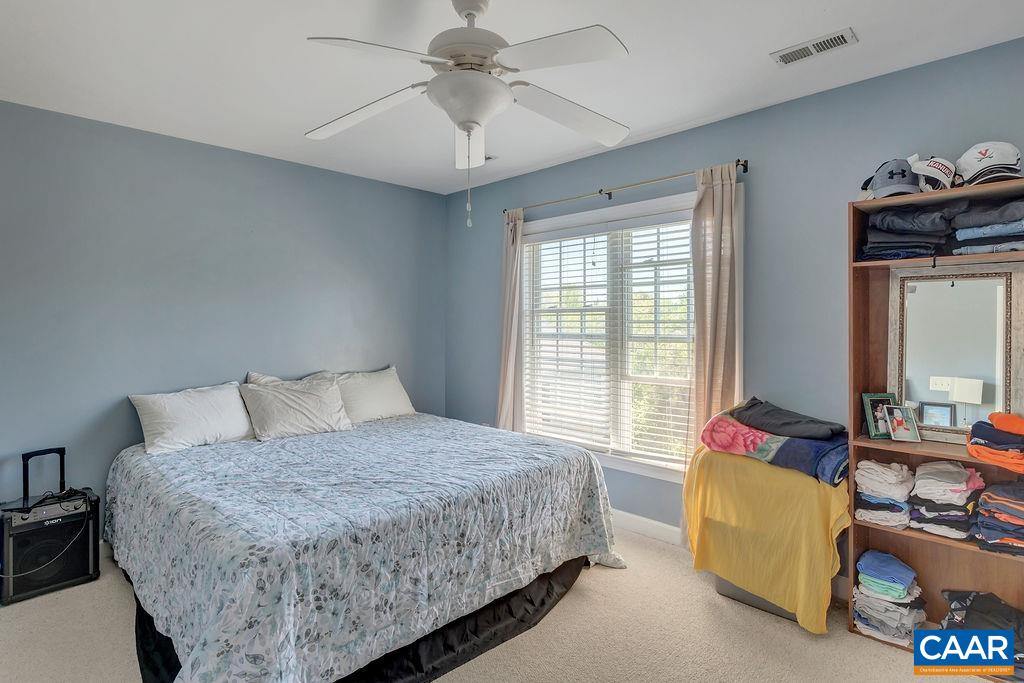 1290 Amber Ridge Road Crozet, VA 22901 - Photo 14 of 22 a bedroom with a bed and a couch