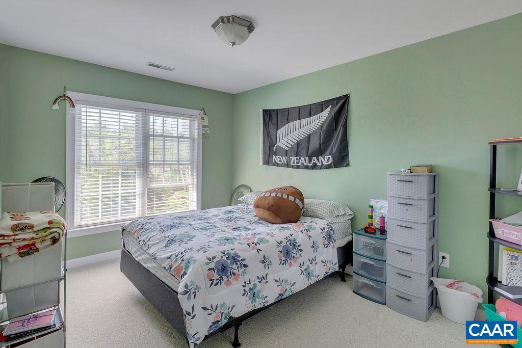 1290 Amber Ridge Road Crozet, VA 22901 - Photo 16 of 22 a bedroom with a bed and a window