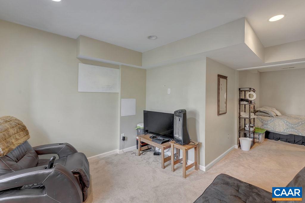 1290 Amber Ridge Road Crozet, VA 22901 - Photo 17 of 22 a living room with furniture and a flat screen tv