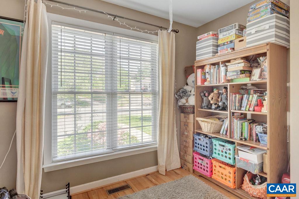 1290 Amber Ridge Road Crozet, VA 22901 - Photo 4 of 22 a room with bookshelf and a window