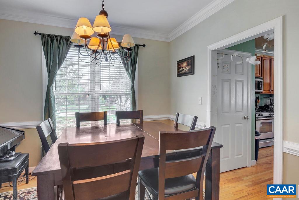 1290 Amber Ridge Road Crozet, VA 22901 - Photo 5 of 22 a view of a dining room with furniture window and wooden floor
