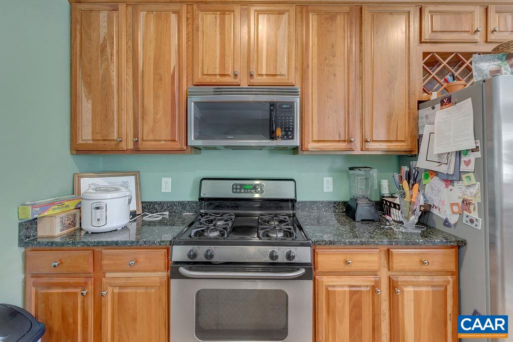 1290 Amber Ridge Road Crozet, VA 22901 - Photo 8 of 22 a kitchen with granite countertop cabinets stainless steel appliances and a sink