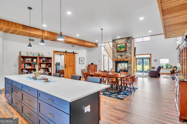 a living room with furniture a rug and a chandelier