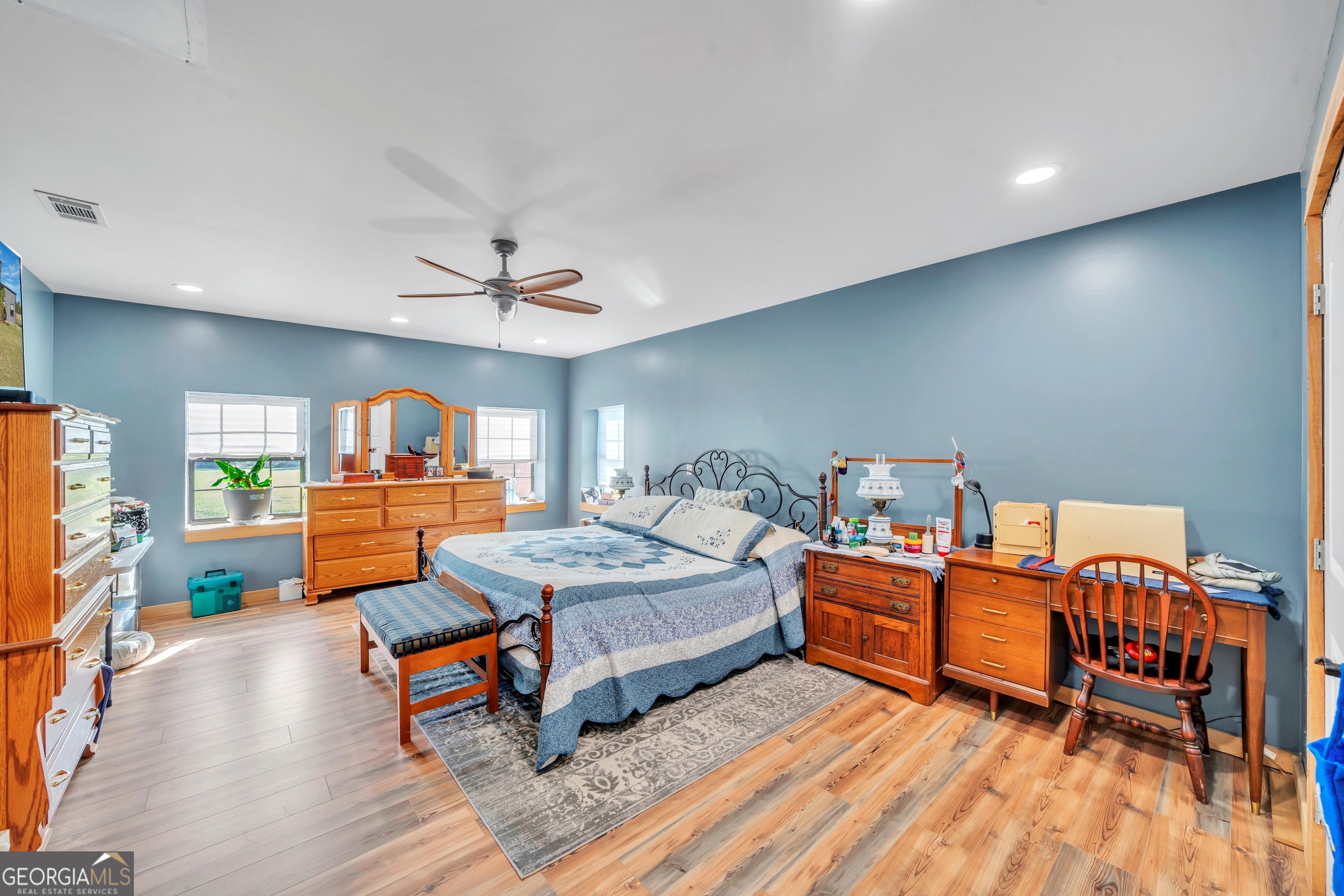 1864 Caulie Harris Road Adel, GA 31620 - Photo 17 of 78 a living room with furniture a rug and a chandelier