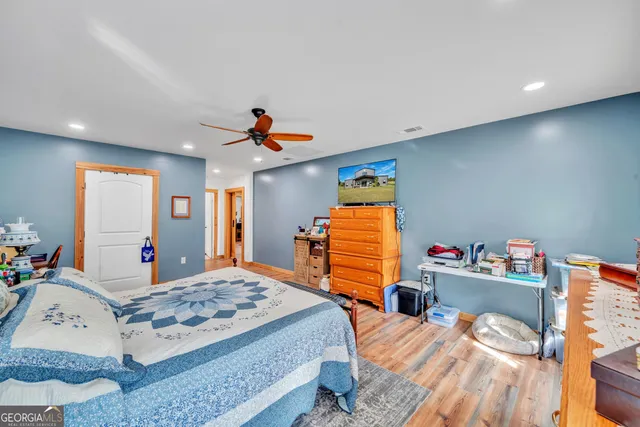 a bathroom with a toilet sink and shower