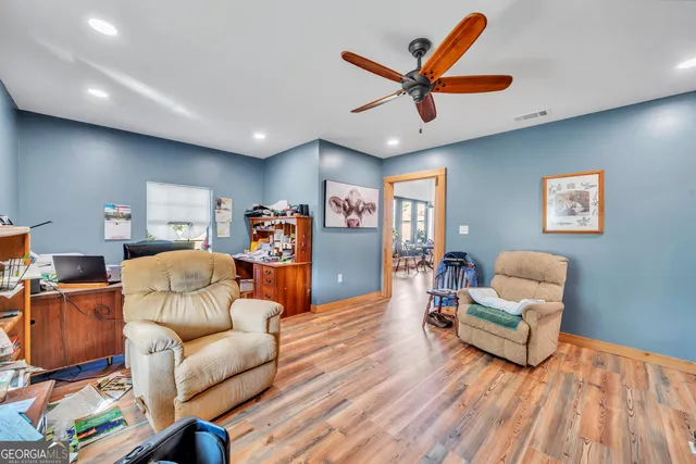 a living room with furniture and a gate