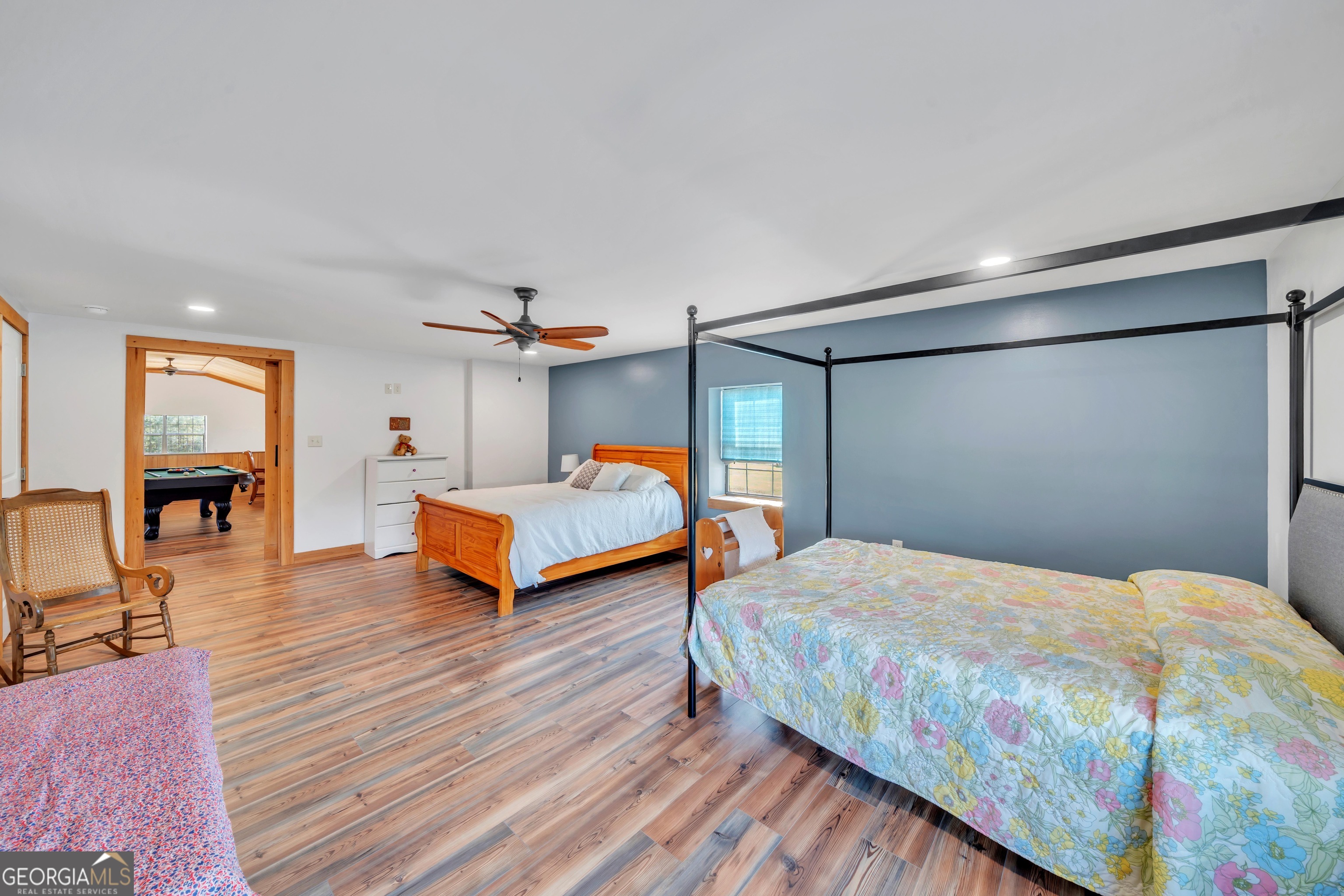 1864 Caulie Harris Road Adel, GA 31620 - Photo 30 of 78 a bedroom with a bed and wooden floor