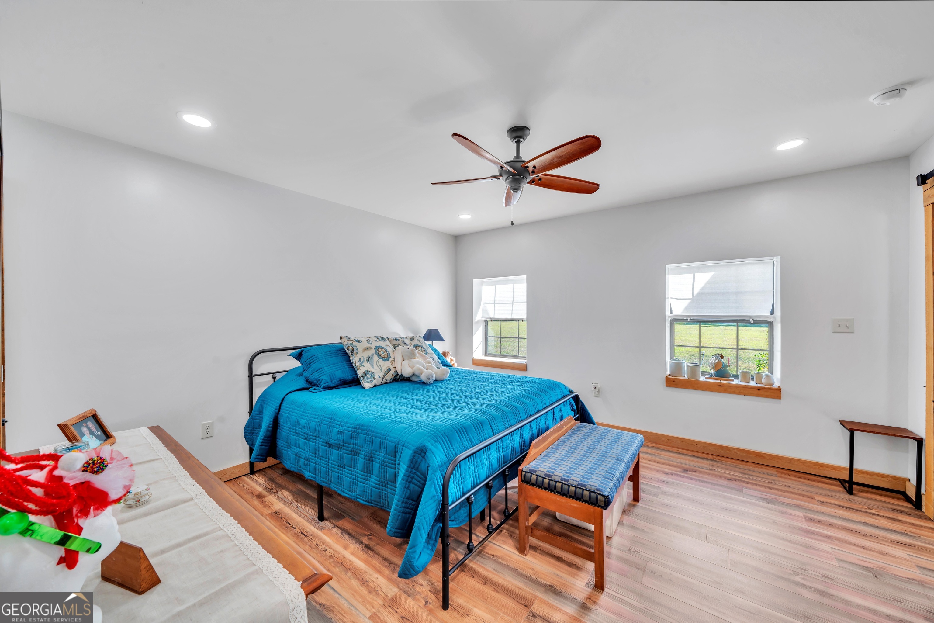 1864 Caulie Harris Road Adel, GA 31620 - Photo 32 of 78 a bedroom with a bed and a chandelier