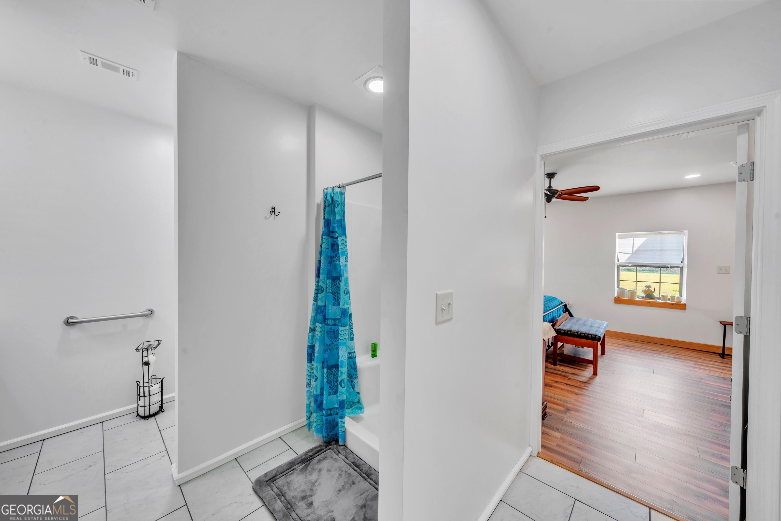 1864 Caulie Harris Road Adel, GA 31620 - Photo 34 of 78 a living room with furniture and a gate