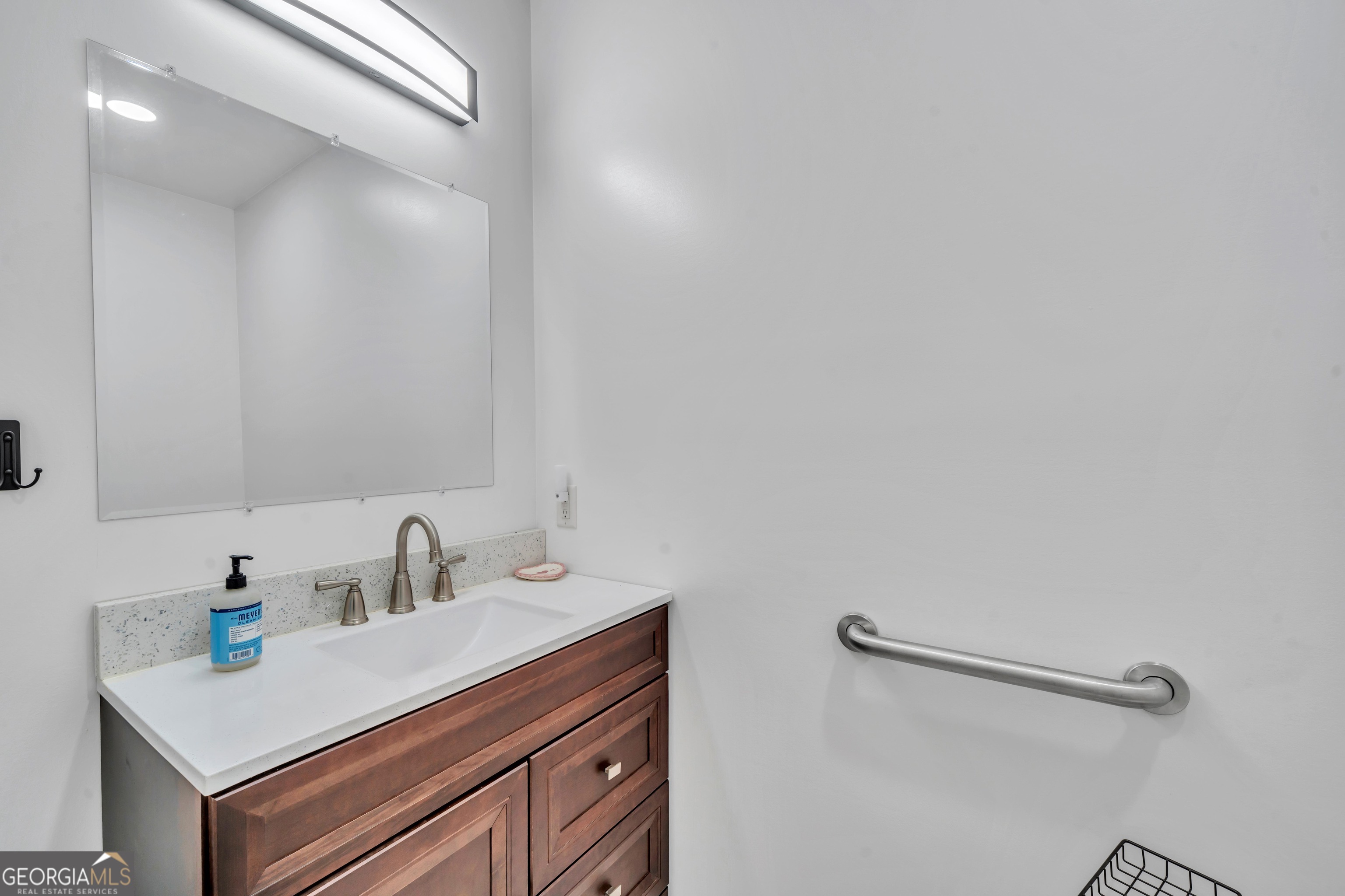 1864 Caulie Harris Road Adel, GA 31620 - Photo 35 of 78 a bathroom with a sink and a mirror