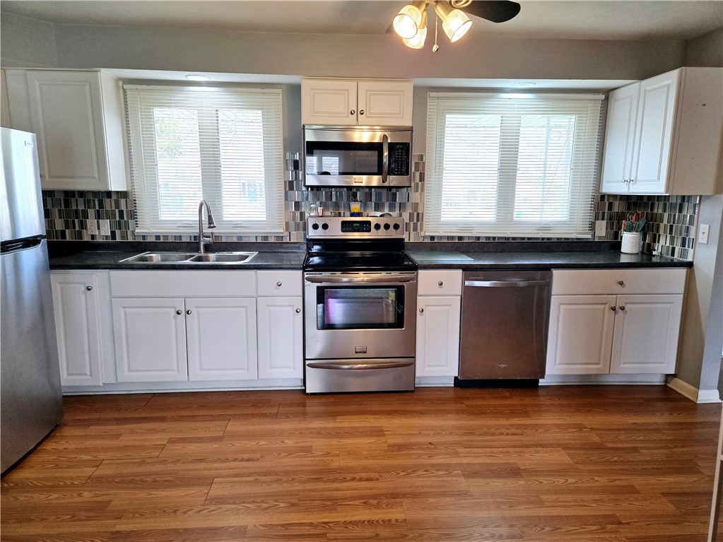 41 Hillhurst Lane Irondequoit, NY 14617 - Photo 5 of 42 The windows light up the room with sunshine.