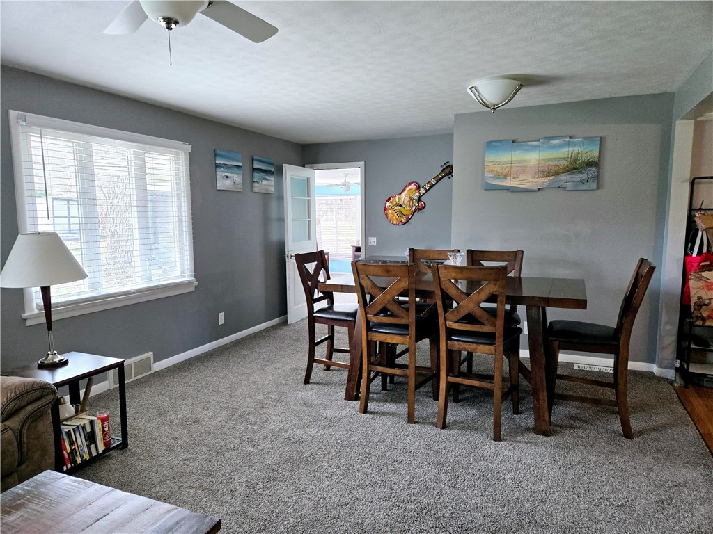 41 Hillhurst Lane Irondequoit, NY 14617 - Photo 7 of 42 The living/dining combo is great for entertaining.