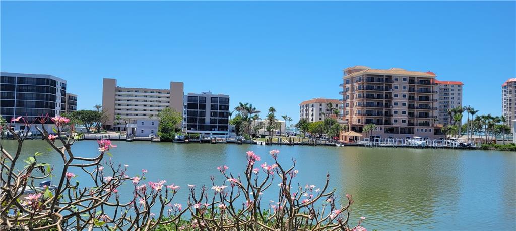 141 Conners Avenue Naples, FL 34108 - Photo 17 of 21 a view of a city with tall buildings