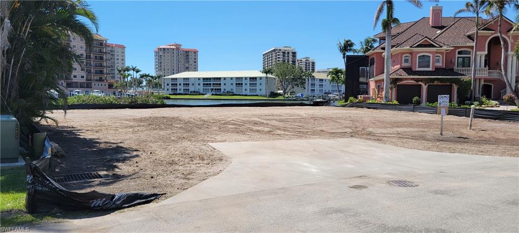 141 Conners Avenue Naples, FL 34108 - Photo 18 of 21 a front view of a building with street view