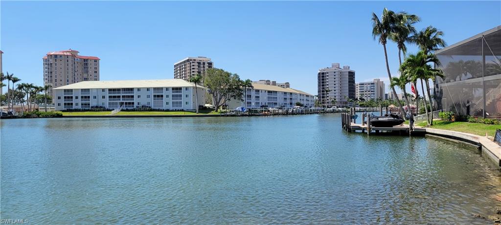 141 Conners Avenue Naples, FL 34108 - Photo 20 of 21 a view of a city with tall buildings