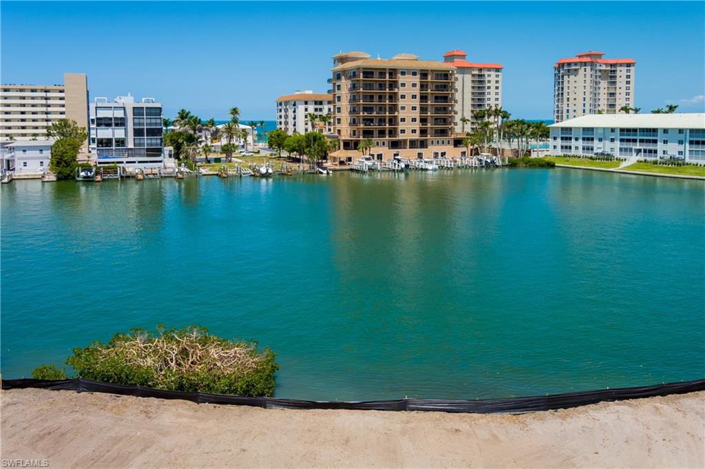 141 Conners Avenue Naples, FL 34108 - Photo 4 of 21 a view of ocean with city view