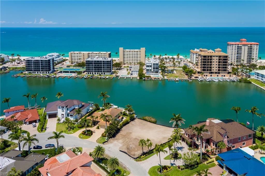 141 Conners Avenue Naples, FL 34108 - Photo 6 of 21 a view of a city with tall buildings