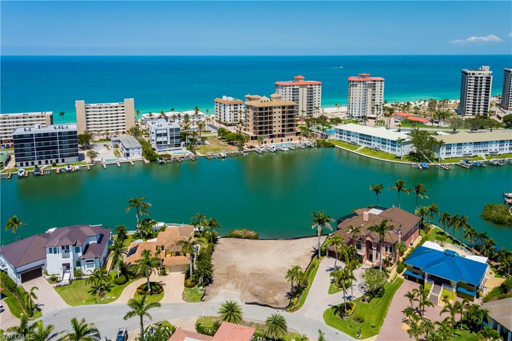 141 Conners Avenue Naples, FL 34108 - Photo 7 of 21 a view of a chairs and table on the terrace