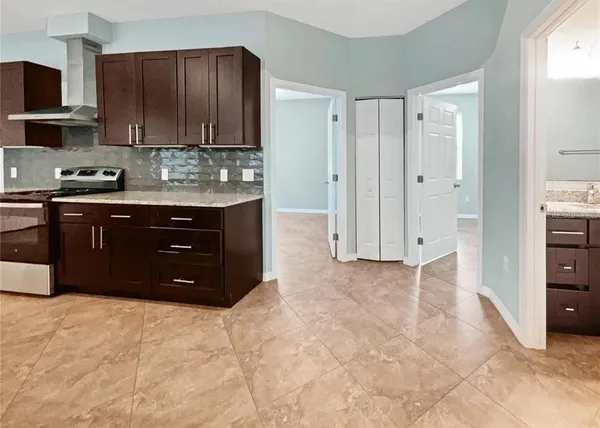 a spacious bathroom with a granite countertop sink and a cabinets