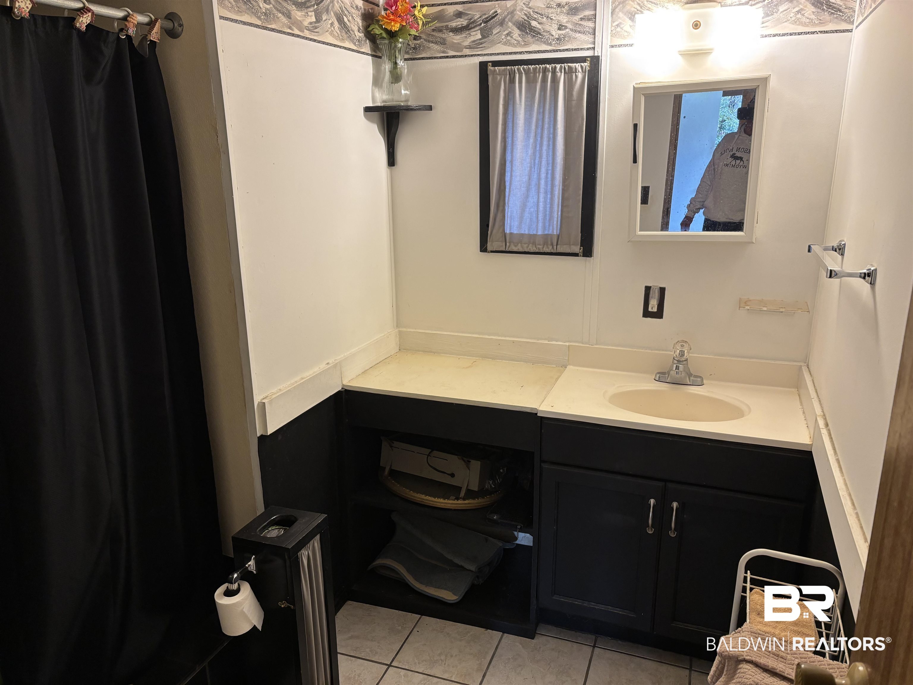 15575 Rogers Drive Chunchula, AL 36521 - Photo 33 of 42 Bathroom featuring tile patterned flooring and vanity