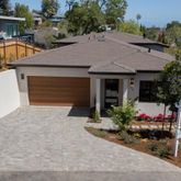 a front view of house with an outdoor space