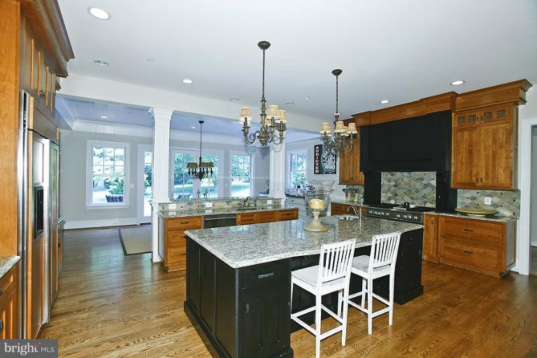 10208 Gary Road Potomac, MD 20854 - Photo 3 of 20 a dining table with chairs and wooden floor