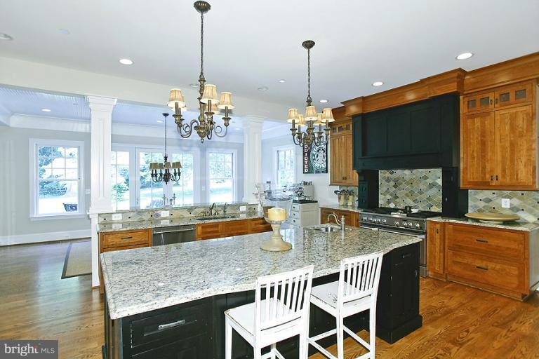 10208 Gary Road Potomac, MD 20854 - Photo 5 of 20 a dining table with chairs and chandelier