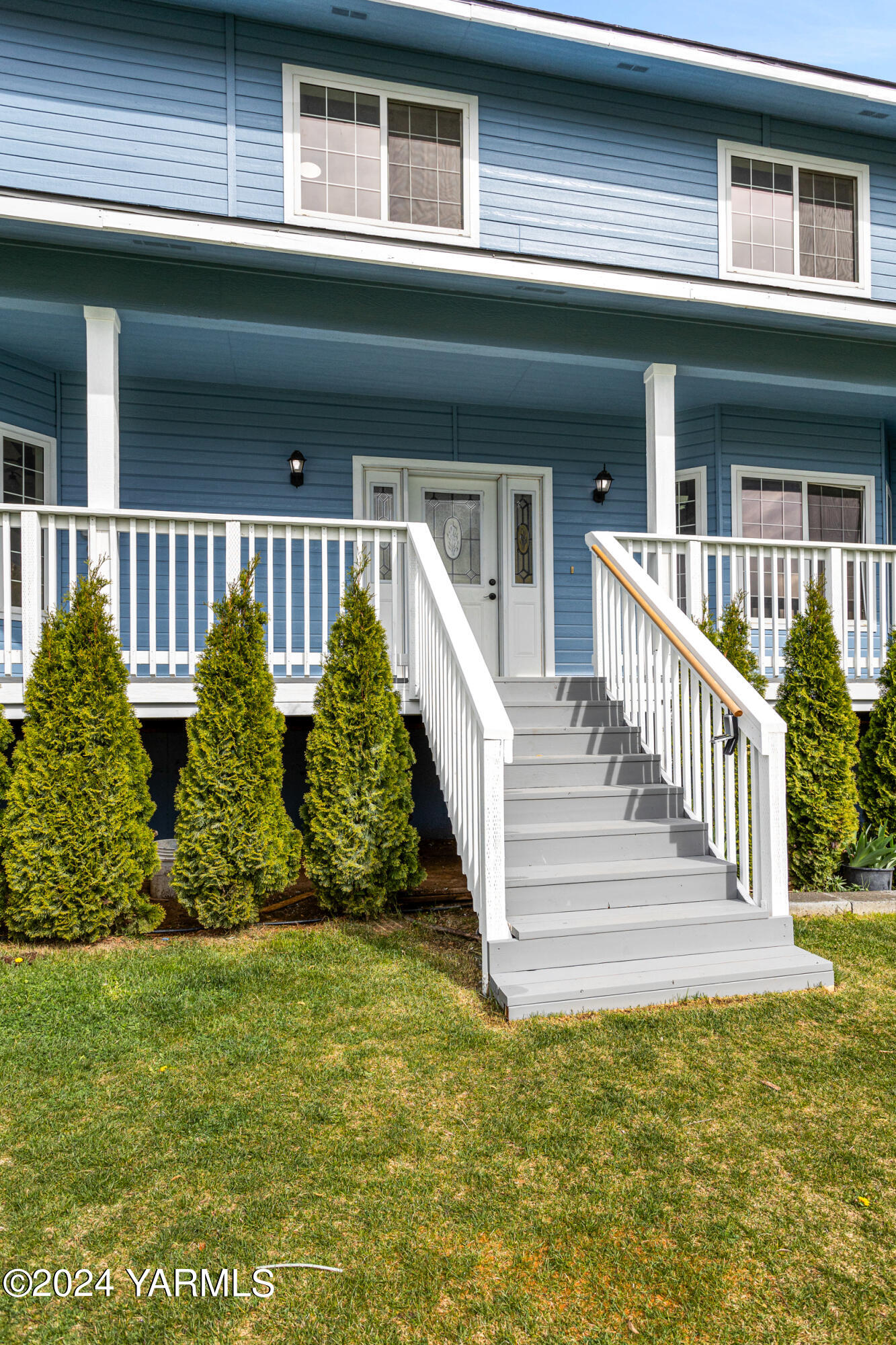 633 Hancock Road Cowiche, WA 98923 - Photo 11 of 53 a view of a house with a small yard plants and large trees